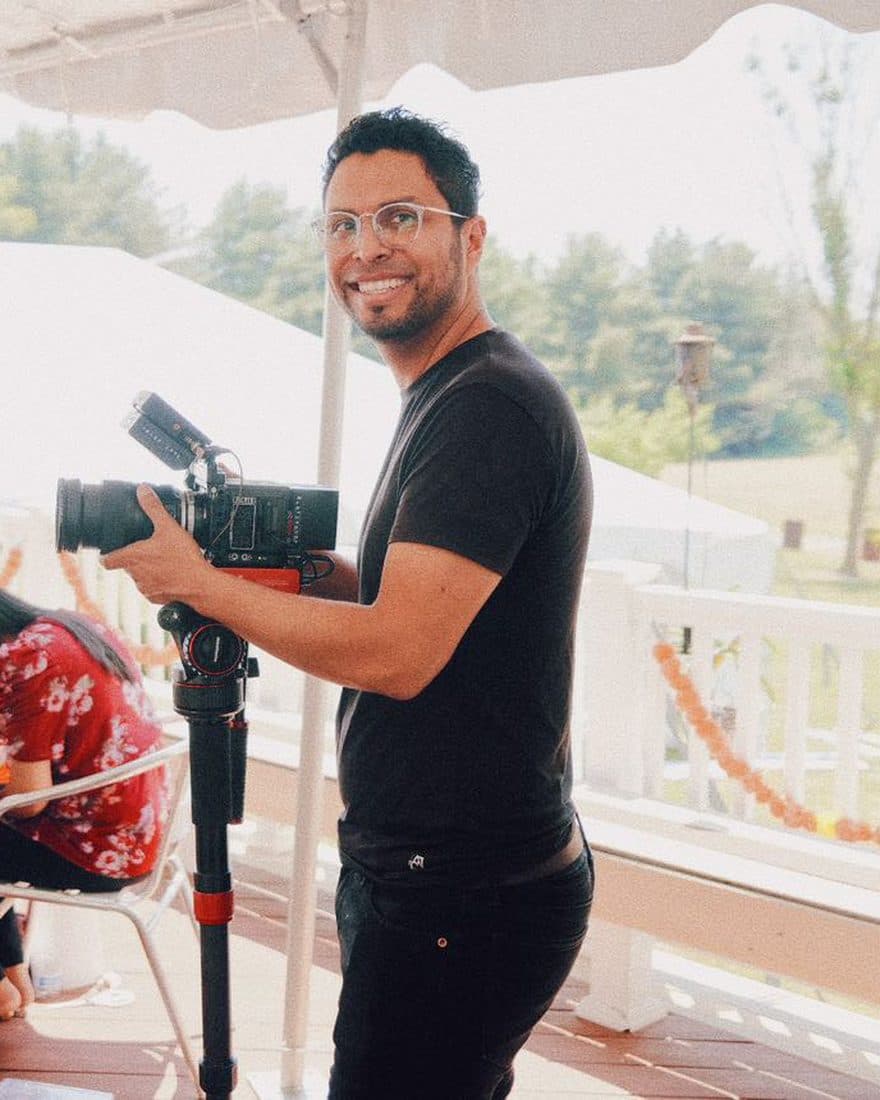 Josué Lemus behind the camera filming a wedding — DC and Twin Cities wedding photographer and filmmaker